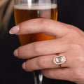 the-hazel-emerald-cut-bezel-engagement-ring-with-diamond-halo