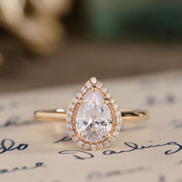 the-hope-pear-shaped-diamond-engagement-ring-diamond-halo