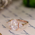 the-ingrid-three-stone-emerald-cut-diamond-engagement-ring-trillion-diamond-side-stones