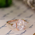 the-ingrid-three-stone-emerald-cut-diamond-engagement-ring-trillion-diamond-side-stones