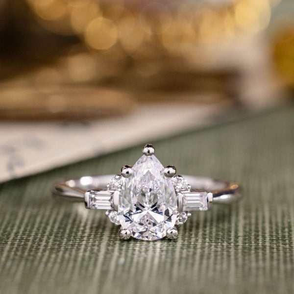 the-juno-pear-shaped-diamond-engagement-ring-straight-baguette-round-diamond-accents