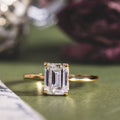 the-lily-solitaire-emerald-cut-diamond-engagement-ring-nature-inspired-setting