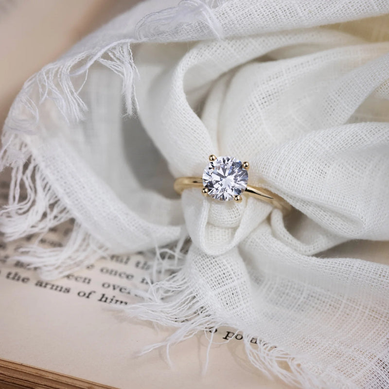 Round Diamond Solitaire with Floral Setting