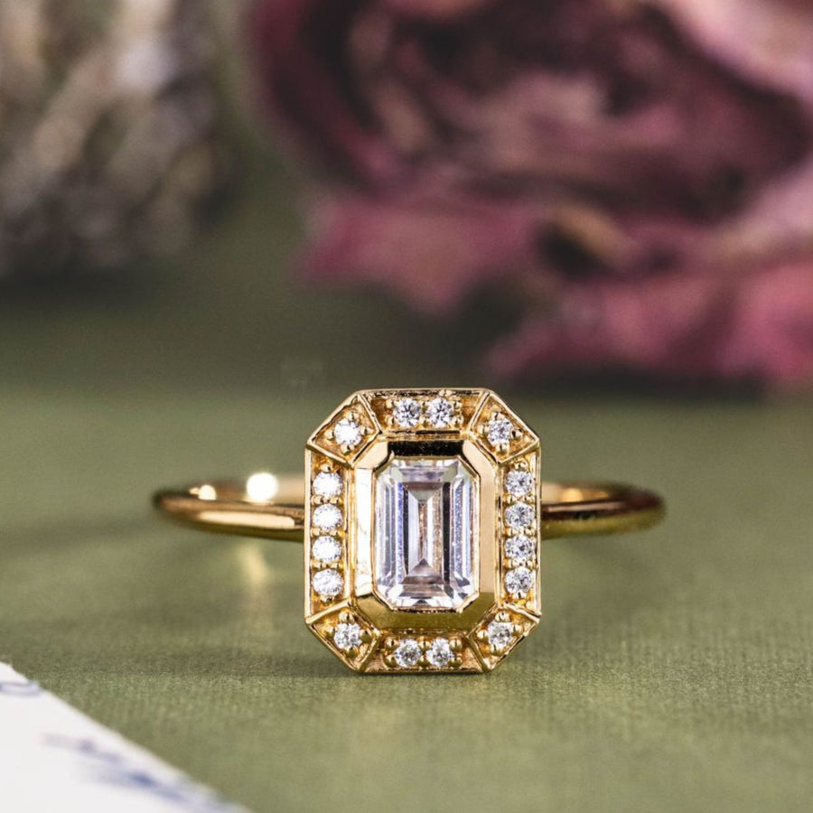 the-margot-emerald-cut-bezel-diamond-halo-engagement-ring