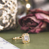the-margot-emerald-cut-bezel-diamond-halo-engagement-ring