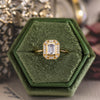 the-margot-emerald-cut-bezel-diamond-halo-engagement-ring