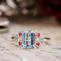 the-maris-emerald-cut-aquamarine-engagement-ring-ruby-diamond-aquamarine-accents