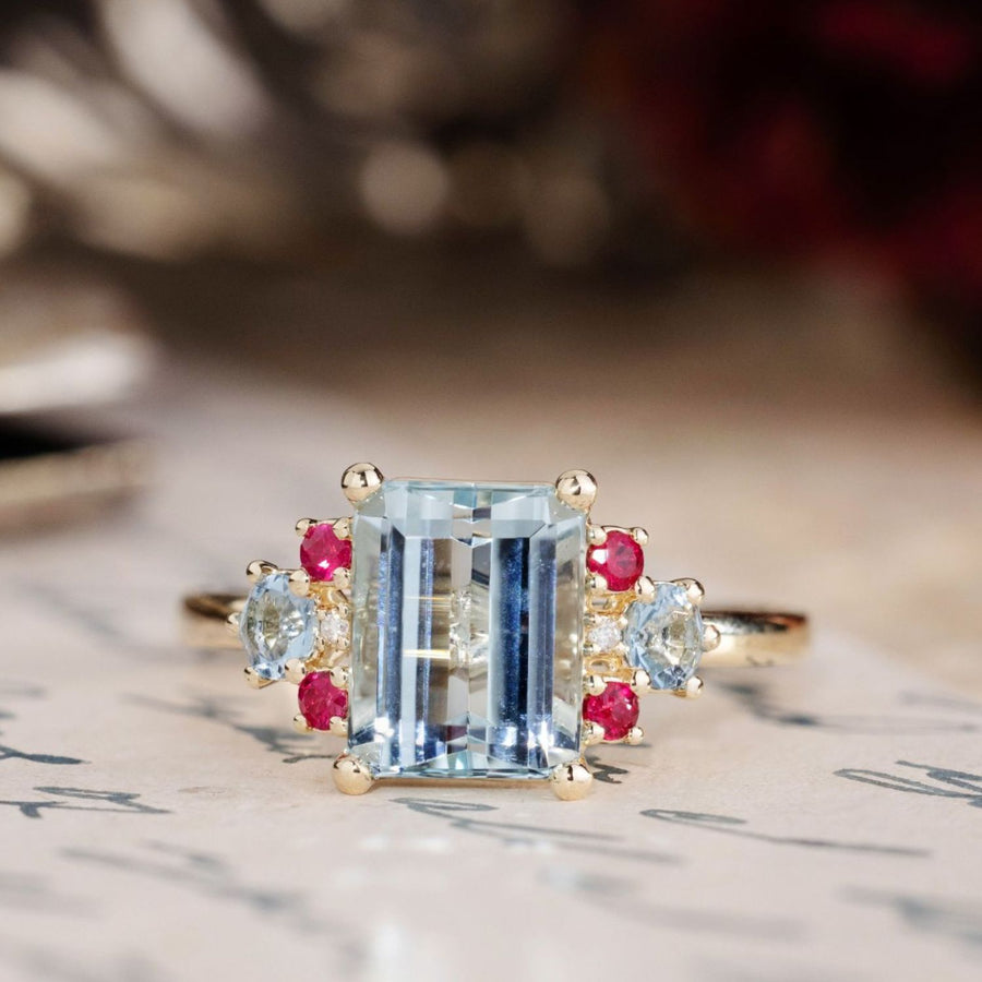 the-maris-emerald-cut-aquamarine-engagement-ring-ruby-diamond-aquamarine-accents