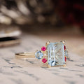 the-maris-emerald-cut-aquamarine-engagement-ring-ruby-diamond-aquamarine-accents