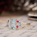 the-maris-emerald-cut-aquamarine-engagement-ring-ruby-diamond-aquamarine-accents