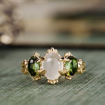 the-myzelle-vintage-inspired-oval-cabochon-three-stone-engagement-ring-moonstone-green-tourmaline
