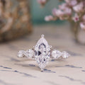 the-nightingale-marquise-diamond-engagement-ring-pear-shaped-diamond-accents