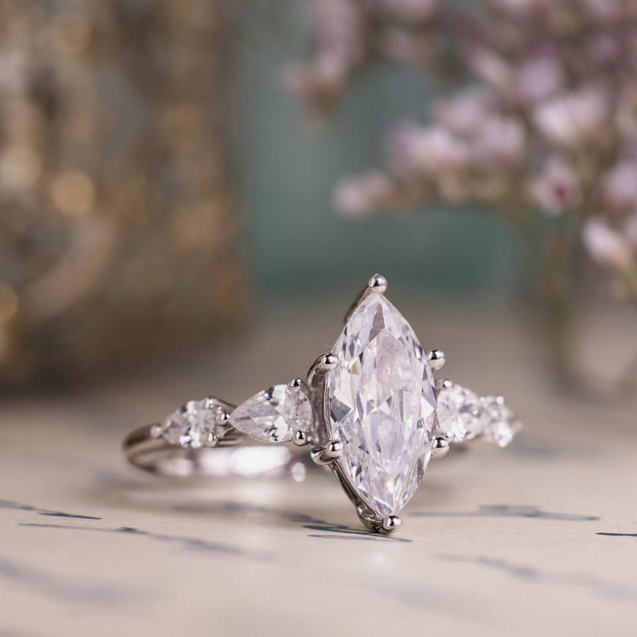 the-nightingale-marquise-diamond-engagement-ring-pear-shaped-diamond-accents