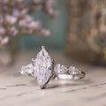 the-nightingale-marquise-diamond-engagement-ring-pear-shaped-diamond-accents