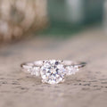 the-odette-three-stone-round-diamond-engagement-ring-pear-shaped-diamond-side-stones