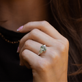 primrose-white-gold-oval-moss-agate-ring-on-hand-close-up