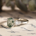 primrose-white-gold-oval-moss-agate-ring-angled-close-up