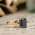 the-raven-emerald-cut-black-moissanite-solitaire-engagement-ring-vintage-inspired-setting