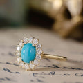 the-robin-oval-turquoise-engagement-ring-diamond-halo