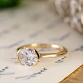 the-soren-east-west-oval-diamond-solitaire-engagement-ring-modern-half-bezel-setting