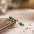 the-tarragon-open-contour-band-kite-step-cut-emeralds