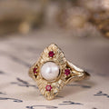 the-theodosia-victorian-inspired-pearl-engagement-ring-anthill-garnet-accents
