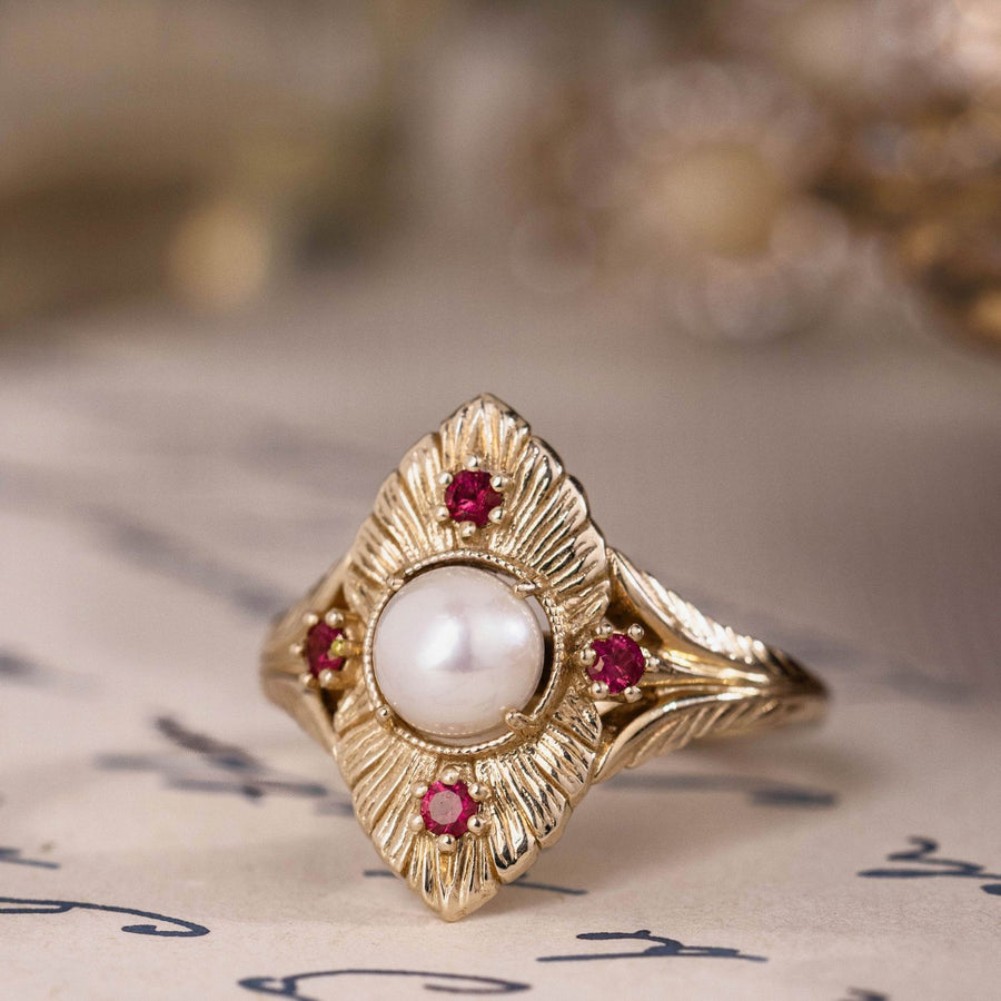 the-theodosia-victorian-inspired-pearl-engagement-ring-anthill-garnet-accents