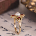 the-theodosia-victorian-inspired-pearl-engagement-ring-anthill-garnet-accents