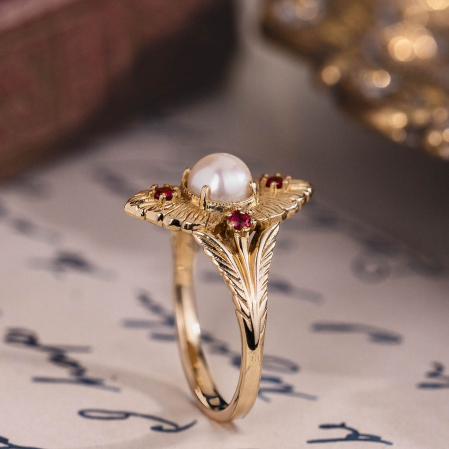 the-theodosia-victorian-inspired-pearl-engagement-ring-anthill-garnet-accents