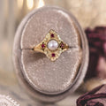 the-theodosia-victorian-inspired-pearl-engagement-ring-anthill-garnet-accents