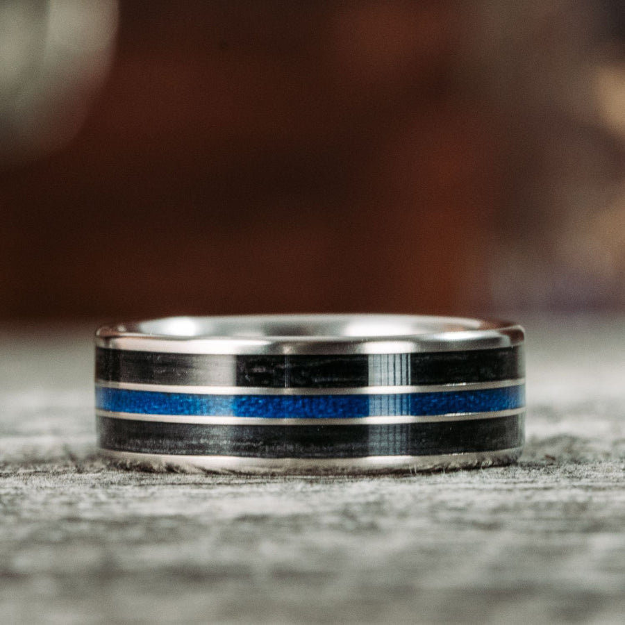 the-thin-blue-line-mens-titanium-wedding-band-with-whiskey-barrel-blue-line