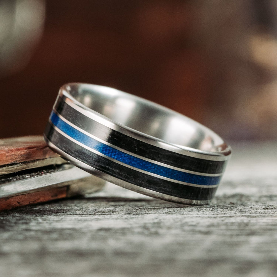 the-thin-blue-line-mens-titanium-wedding-band-with-whiskey-barrel-blue-line