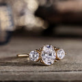 the-wren-oval-diamond-three-stone-engagement-ring-round-diamond-accents