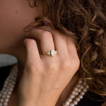 three-stone-emerald-cut-diamond-engagement-ring-round-diamond-accents-bezel-setting-the-marcelline-rustic-and-main
