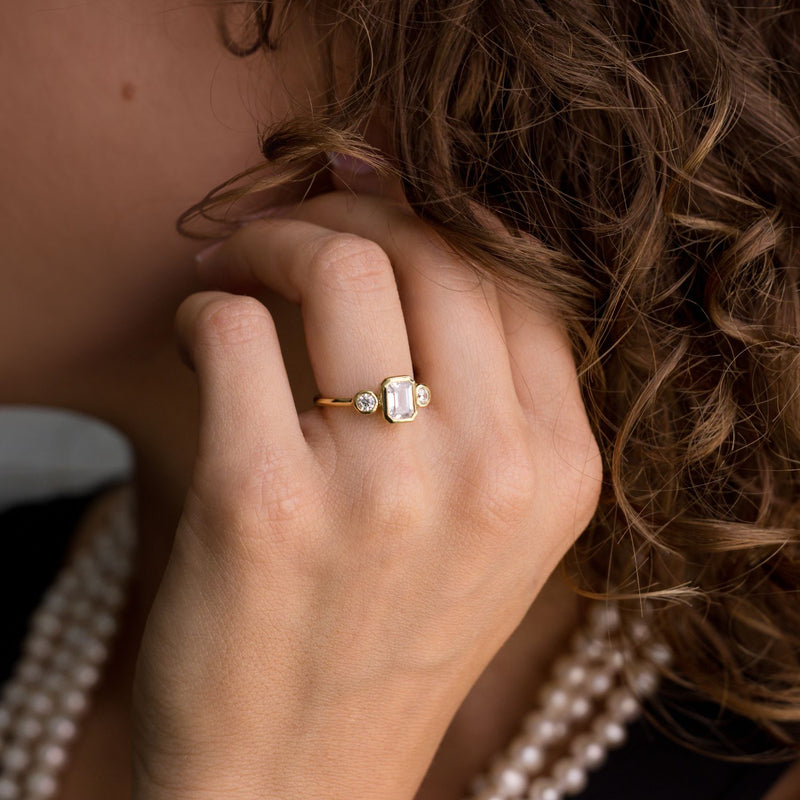 three-stone-emerald-cut-diamond-engagement-ring-round-diamond-accents-bezel-setting-the-marcelline-rustic-and-main