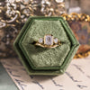 three-stone-emerald-cut-diamond-engagement-ring-round-diamond-accents-bezel-setting-the-marcelline-rustic-and-main