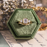 three-stone-emerald-cut-diamond-engagement-ring-round-diamond-accents-bezel-setting-the-marcelline-rustic-and-main