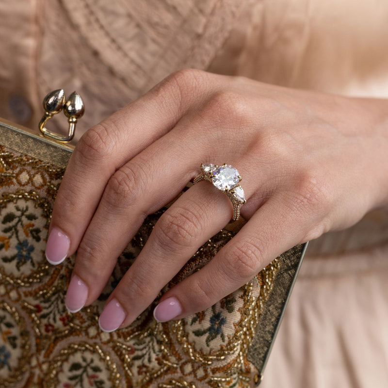 three-stone-oval-diamond-engagement-ring-pear-shaped-diamond-accents-pave-setting-the-marielle-rustic-and-main