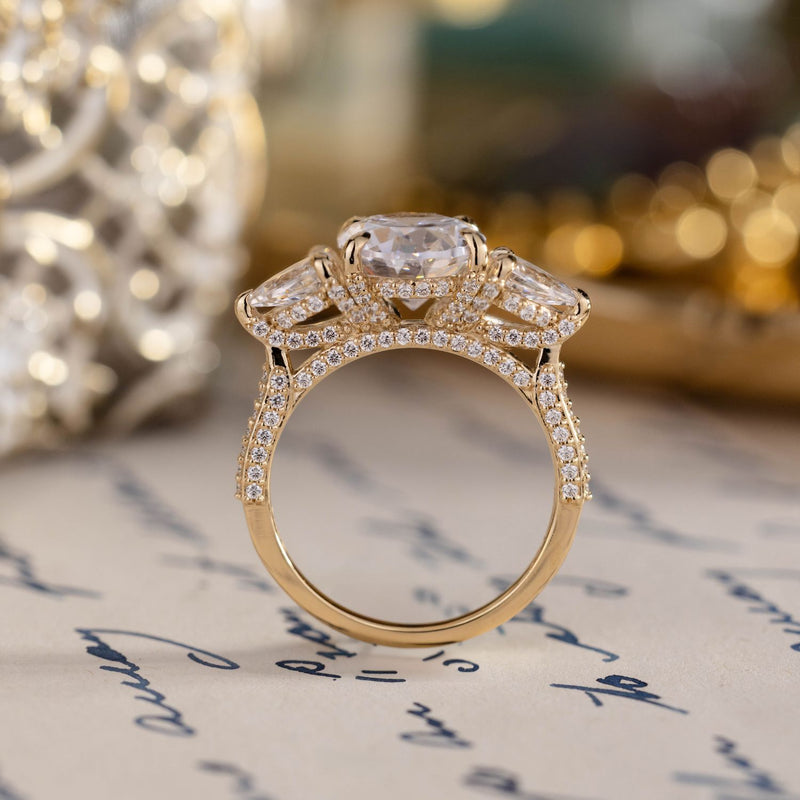 three-stone-oval-diamond-engagement-ring-pear-shaped-diamond-accents-pave-setting-the-marielle-rustic-and-main