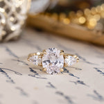 three-stone-oval-diamond-engagement-ring-pear-shaped-diamond-accents-pave-setting-the-marielle-rustic-and-main