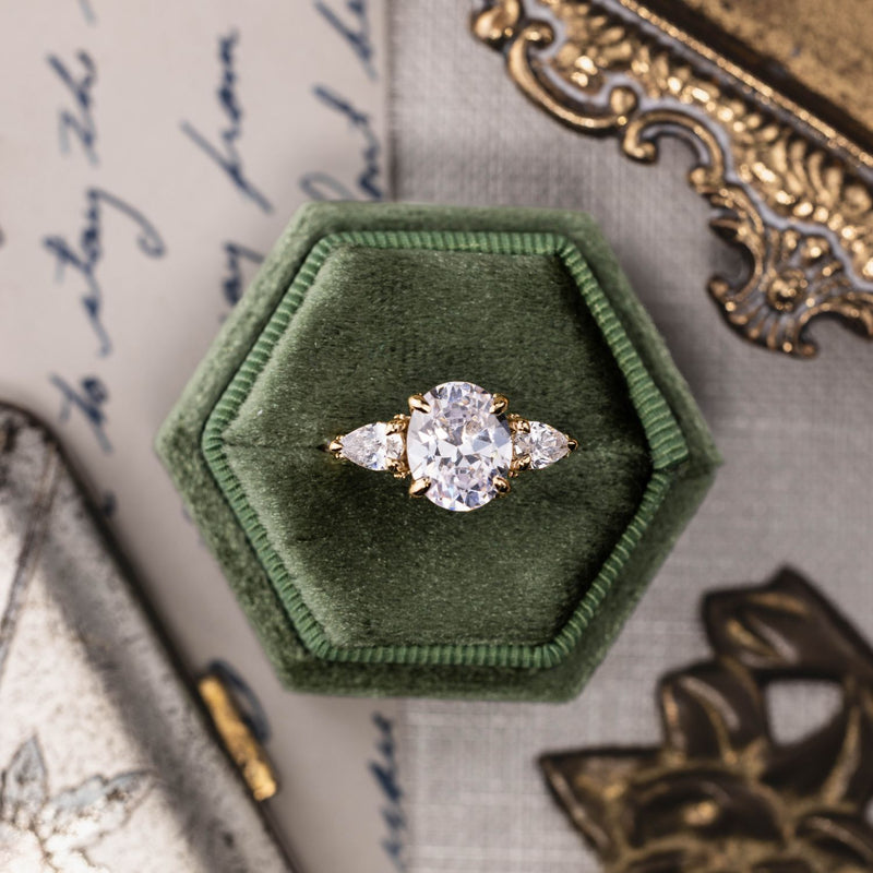 three-stone-oval-diamond-engagement-ring-pear-shaped-diamond-accents-pave-setting-the-marielle-rustic-and-main