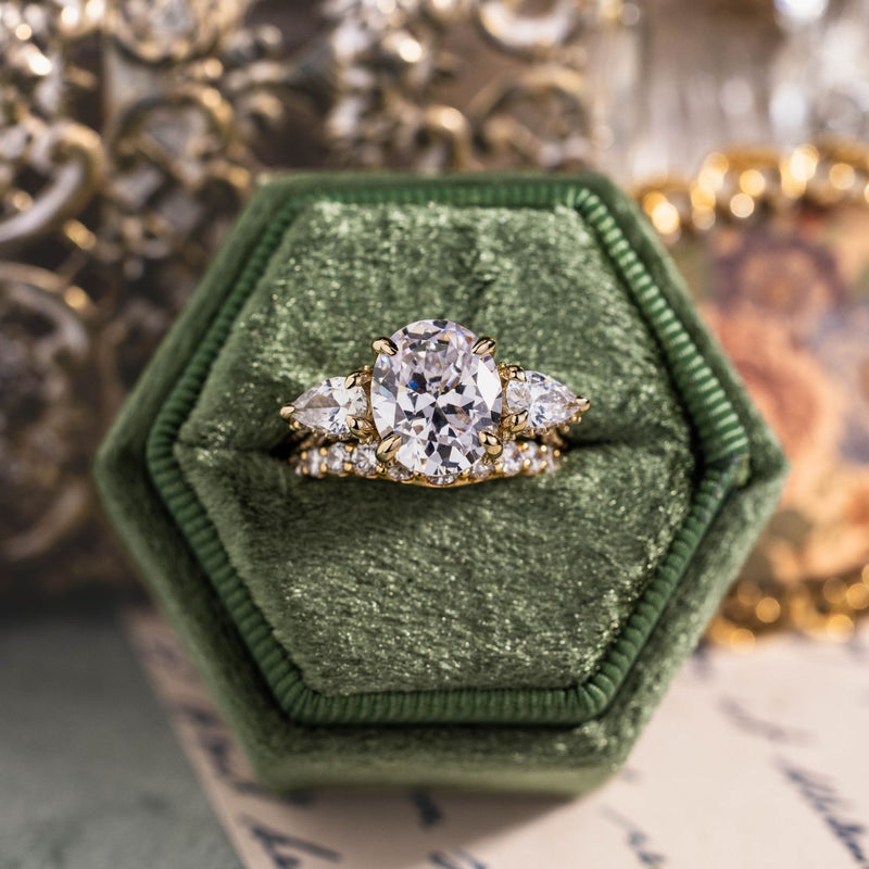 three-stone-oval-diamond-engagement-ring-pear-shaped-diamond-accents-pave-setting-the-marielle-rustic-and-main