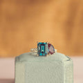 toi-et-moi-engagement-ring-pear-shaped-alexandrite-emerald-cut-london-blue-topaz-the-elara-rustic-and-main