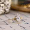 vintage-inspired-oval-diamond-engagement-ring-starburst-diamond-halo-pave-split-shank-setting-the-genevieve-rustic-and-main