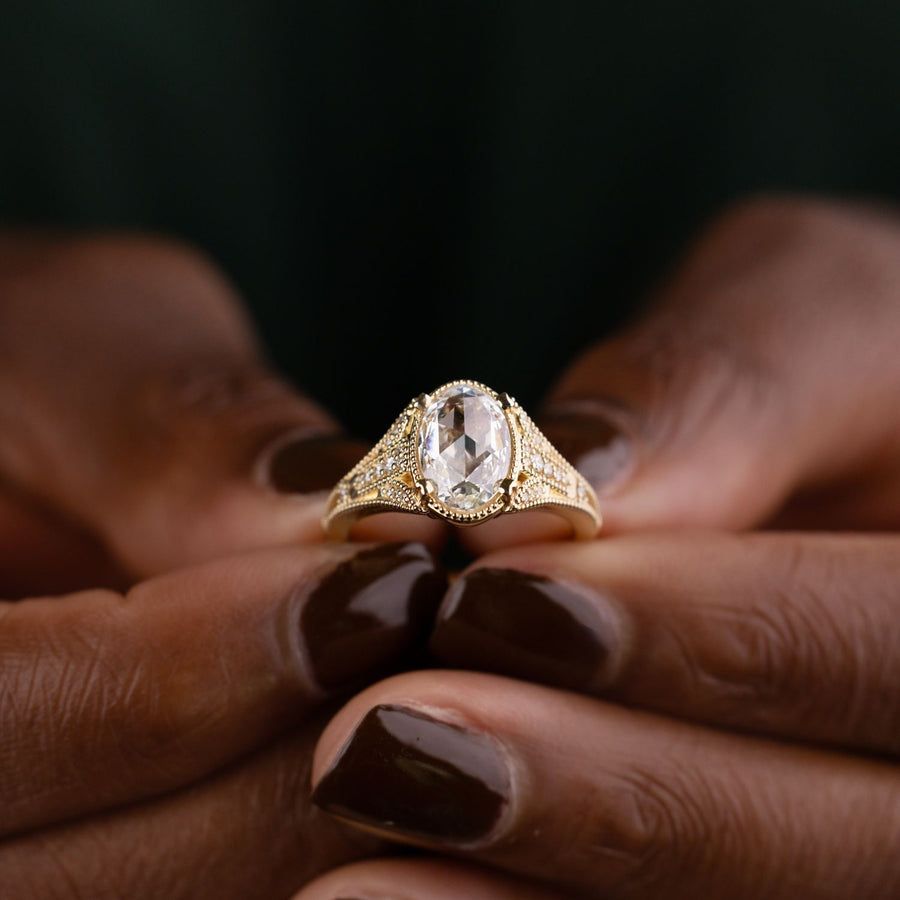 Vintage-Inspired Oval Diamond Engagement Ring with Diamond and Milgrain Accents